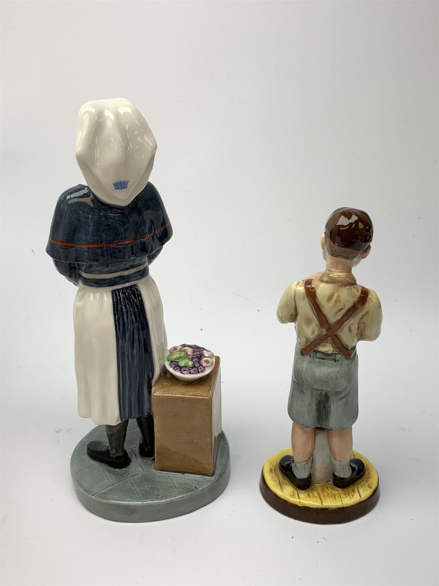 A limited edition Royal Doulton figurine, Queen Alexandra Nurse HN4596, 206/2500, with box and certificate, together with another limited edition Royal Doulton figurine, The End of Sweet Rationing, HN5023, 286/1500, with box and certificate. 