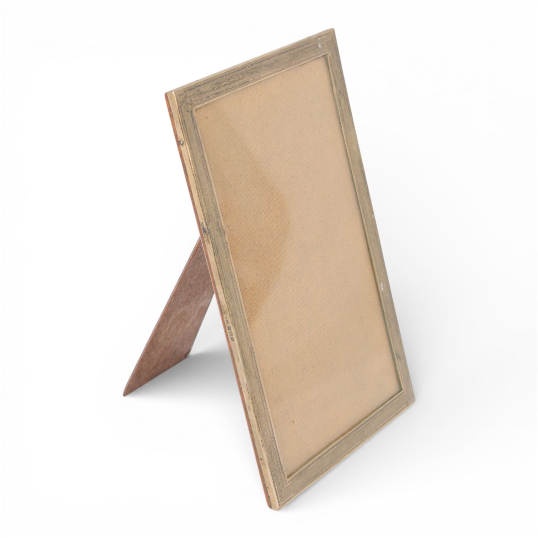 Mid 20th century silver mounted photograph frame, of rectangular form with engine turned decoration, with wooden easel support verso, hallmarked Charles Edwin Turner, Birmingham 1945, H28cm