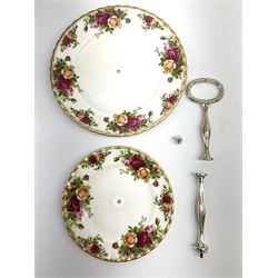 Royal Albert Old Country Roses part dinner and tea service comprising teapot, four tea cups and saucers, eight dessert plates, cake plate, cake stand, a tureen with cover, six dinner plates, an oval dish, two trinket dishes, bell and shoe decoration. 