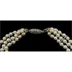 Three strand pearl necklace, with platinum diamond milgrain clasp and a single strand graduating pearl necklace with 18ct white gold clasp set with a diamond
