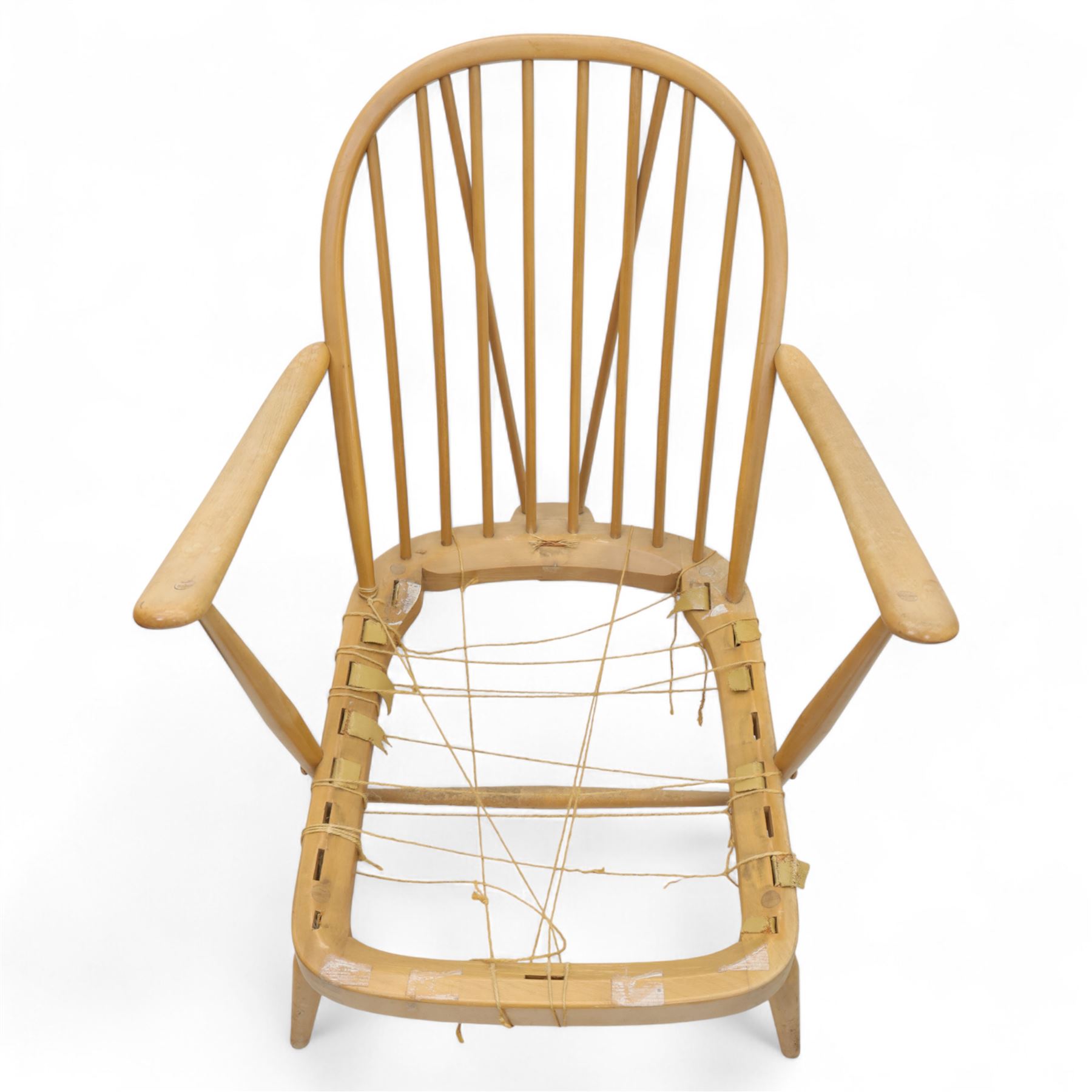 Ercol - Model '203', pair of easy chairs, with blue upholstered cushions and additional orange covers, with looped backrest and shaped spindles, outward swept arms, drop in seat frame