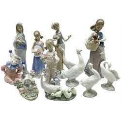 Lladro figures, comprising of  kitty confrontation 1442, Spring 5217, Courtney 5648, Girl with Calla Lilies 4650, Girl with puppies 1311, feeding time 1052, little goose 4552, little goose 4553 and little ducks after mother 1307, together with two Nao figures, goose 00245 and   Jester Clown Jingles 1065, all with original boxes. 