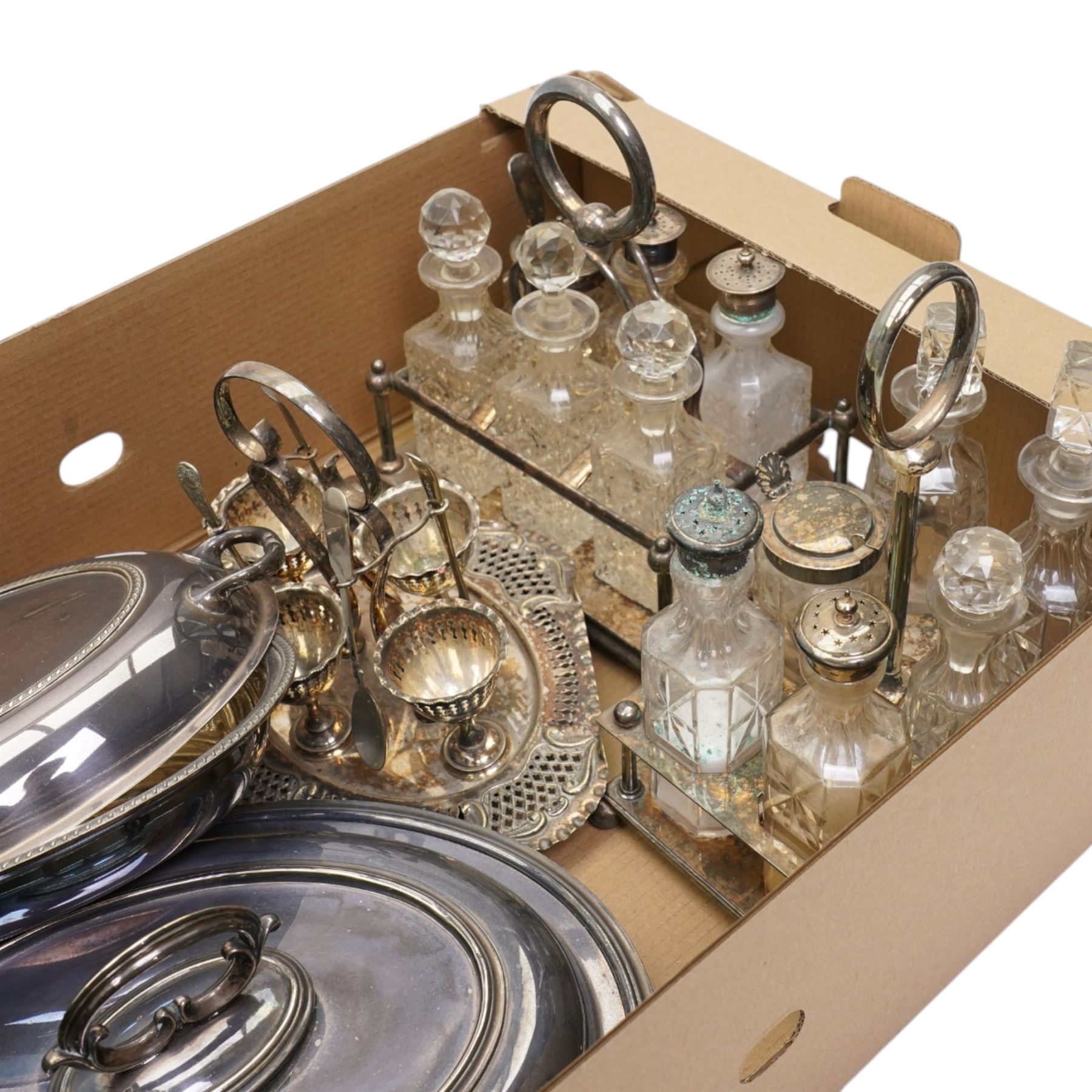 Two glass and silver plated six bottle cruets, plated egg cruet and two entree dishes