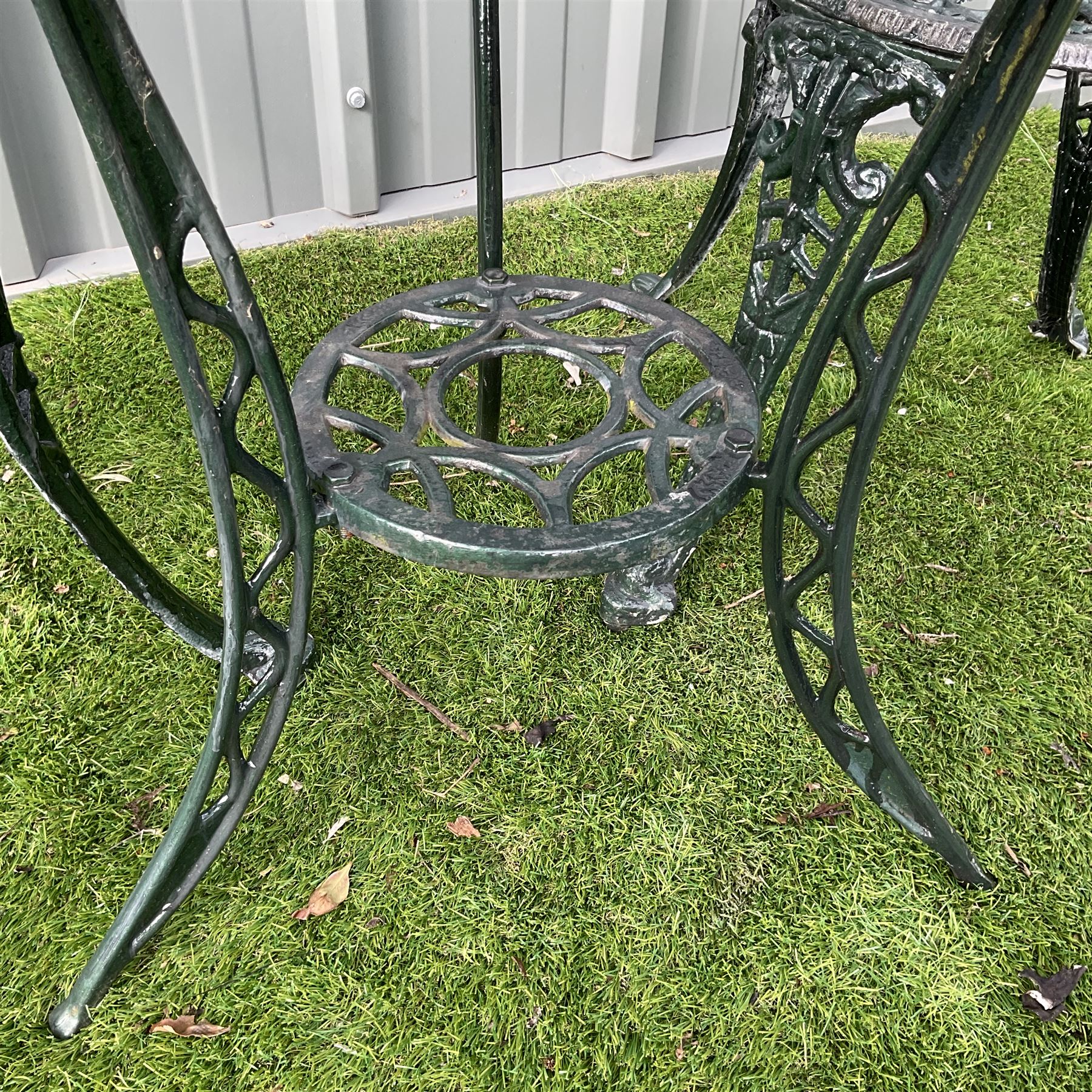 Cast aluminium garden table and two chairs with cast iron side table painted in dark green - THIS LOT IS TO BE COLLECTED BY APPOINTMENT FROM DUGGLEBY STORAGE, GREAT HILL, EASTFIELD, SCARBOROUGH, YO11 3TX