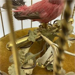Swiss Reuge Music bird cage automaton music box, the bird with articulated head and beak, in a gilt brass cage, with a glass dome and stand, H30cm