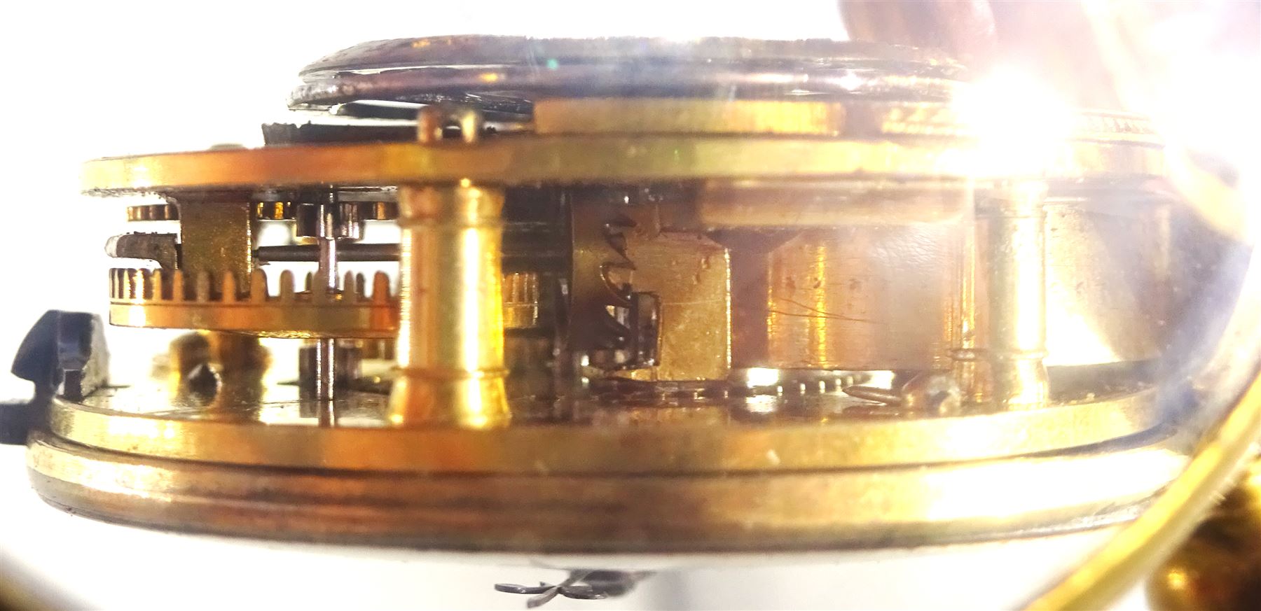 George III gilt verge fusee pocket watch by William Brown, London, No. 219, round baluster pillars, white enamel dial with Arabic numerals, bull's eye glass and one other gilt verge fusee front wound pocket watch (2)