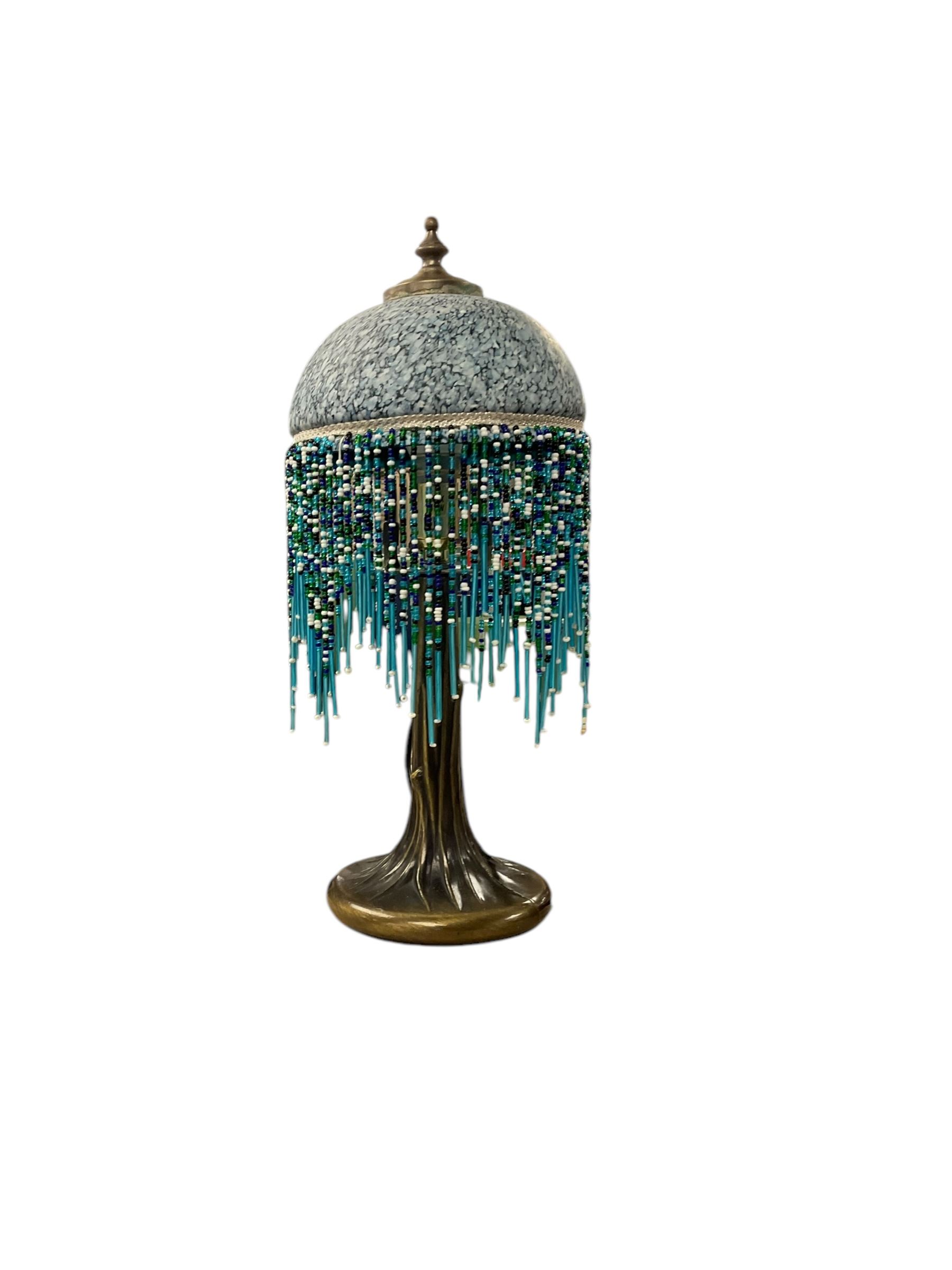 Figural lamp from 'The Juliana Collection', with cream shade, H85cm, together with a lamp with mottled glass shade 