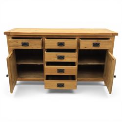 Modern light oak sideboard, fitted with six drawers and two cupboards