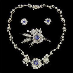 Silver synthetic sapphire and white paste stone set flower necklace, brooch and matching p...