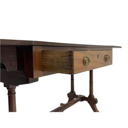 George III mahogany sofa table, rectangular drop-leaf top with reed moulded edge and rounded corners, fitted with two frieze drawers and two opposing false drawers, quadruple collar turned pillar supports on turned and block platforms, splayed and moulded supports with brass cups and castors 