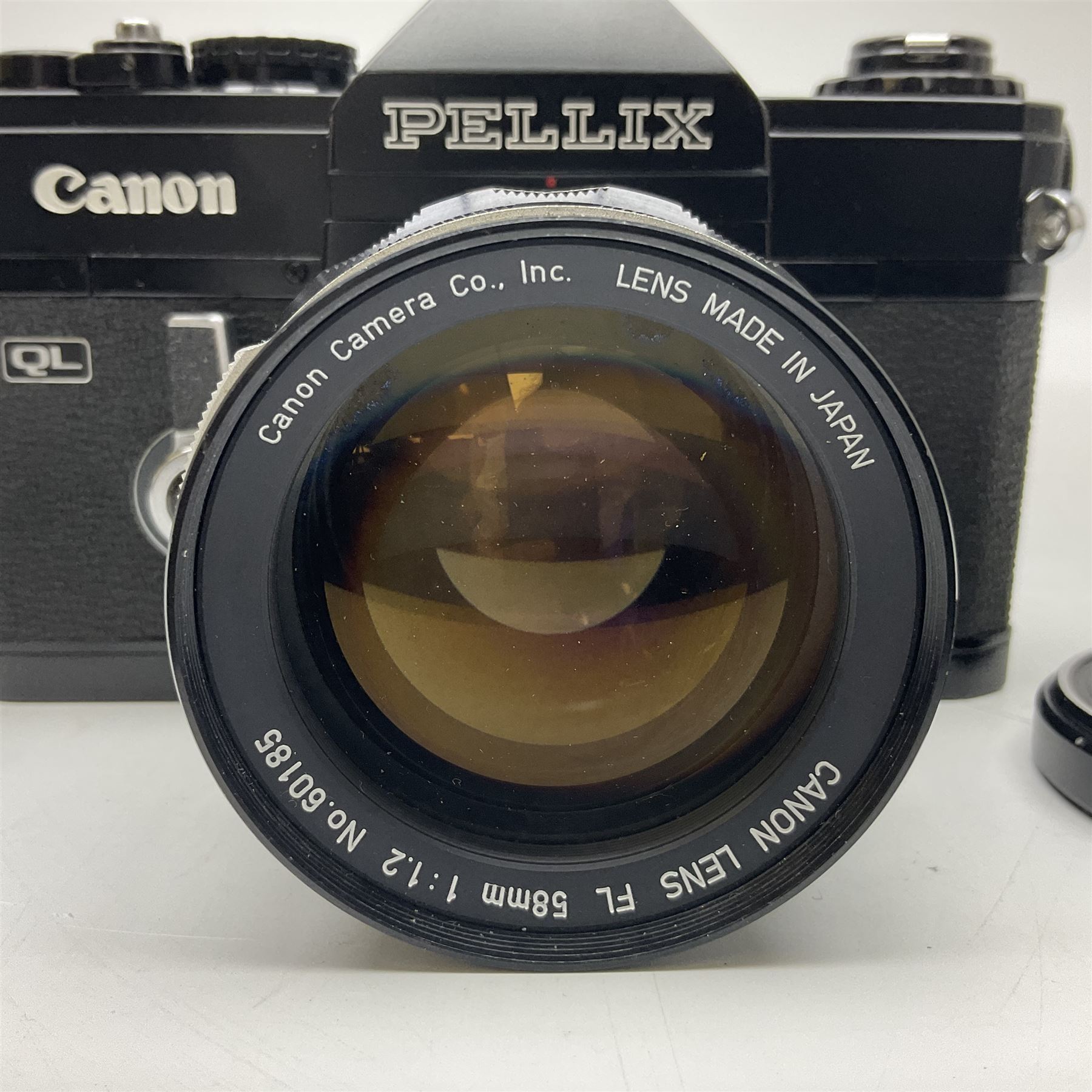 Canon QL Pellix camera body, serial no. 807468, with 'Canon FL 58mm 1:1.2' lens, serial no. 60185