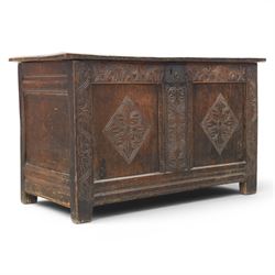18th century oak coffer with carved frieze and rails, rectangular plank top with iron strap hinges, raised on stile supports