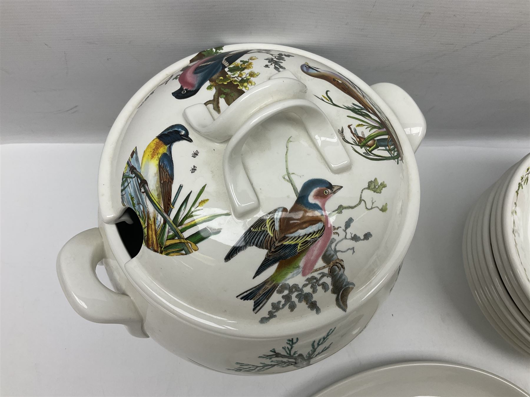 Portmeirion Birds of Britain pattern, dinner service for eight, to include covered soup tureen with ladle, dinner plates, soup bowls, side plates, oval plates, a serving platter, two oval serving dishes, salt and pepper, etc and eight shell dishes in the British fish pattern (56) 