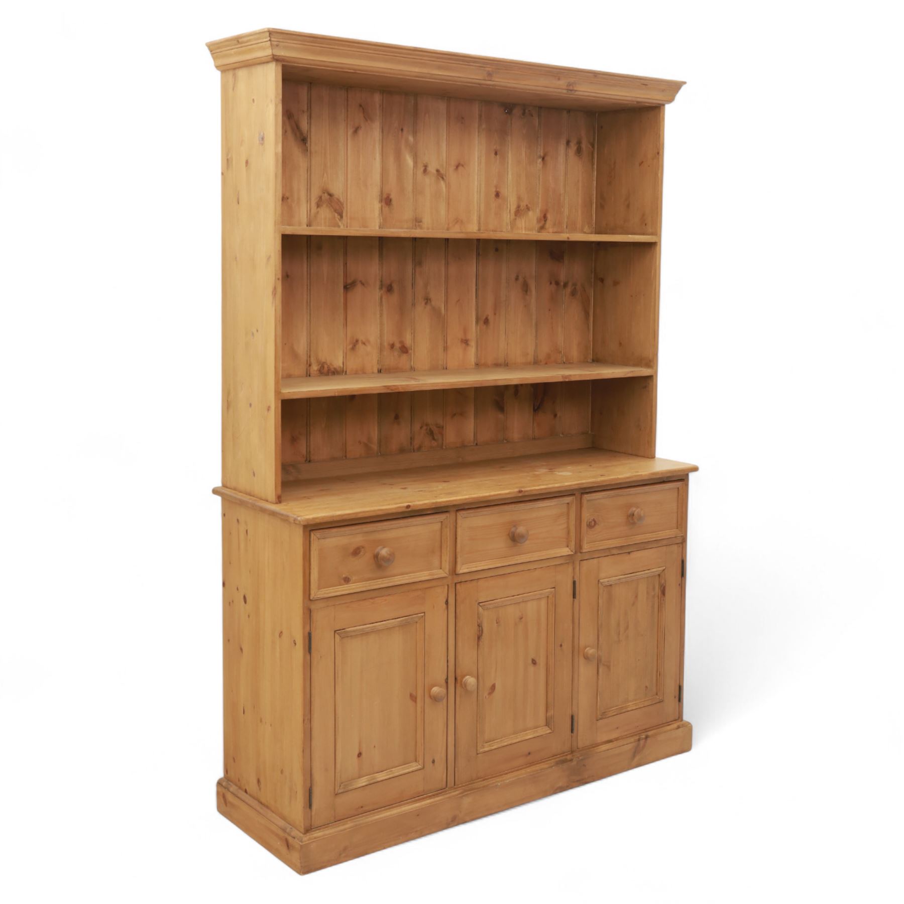 Late 20th century pine kitchen dresser, the upper section with open shelves and tongue and groove back, over a triple cupboard base with three drawers, turned wooden knobs throughout