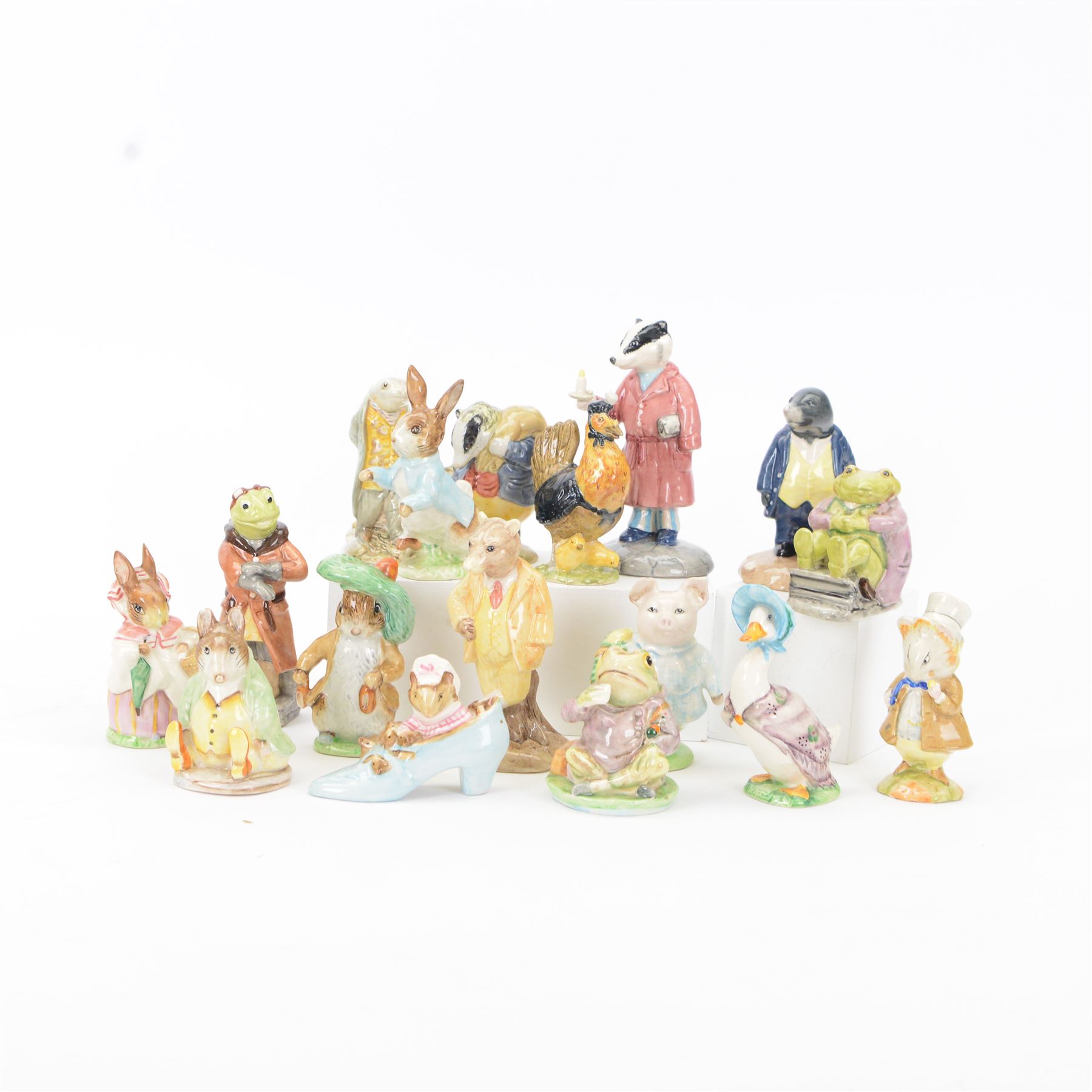 Seventeen Beswick figures, including Wind in the Willow figures; Badger, Frog, Mole and Ratty, Beatrix Potter figures; Sir Issac Newton, Mr Jackson, Mr Jeremy Fisher etc 