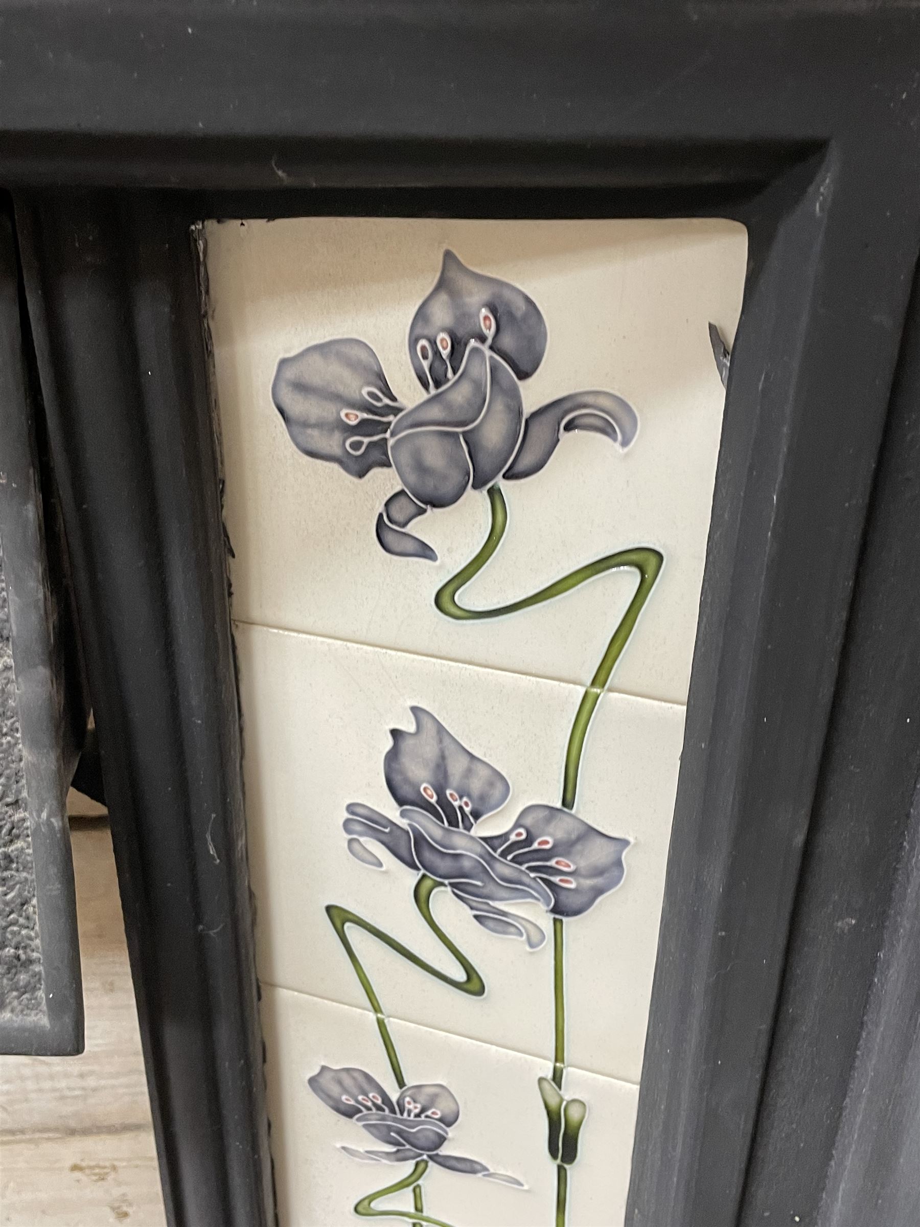 The Gallery Collection Fireplaces - 'Edwardian' cast iron fireplace, the hood decorated with interlacing floral design, with Art Nouveau inspired upright tiles