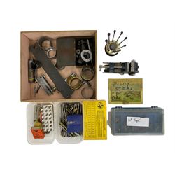 Clock mainspring winder, bench vice, assortment of clock pivot steel, Bergeron clock and watch bushes, watch keys, watchmakers screwdrivers, BA taps, letter punches and pin vices.