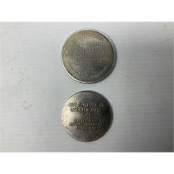 Four post-WW2 'silver' medallions of Adolf Hitler/German interest, two depicting Von Hindenburg also; and pair of 1960s trench art shell case bases as ashtrays mounted with Libyan Five Milliemes coins as cigarette rests (6)