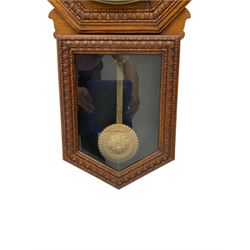 American - early 20th century  drop dial oak cased wall clock, with a hexagonal surround and 12