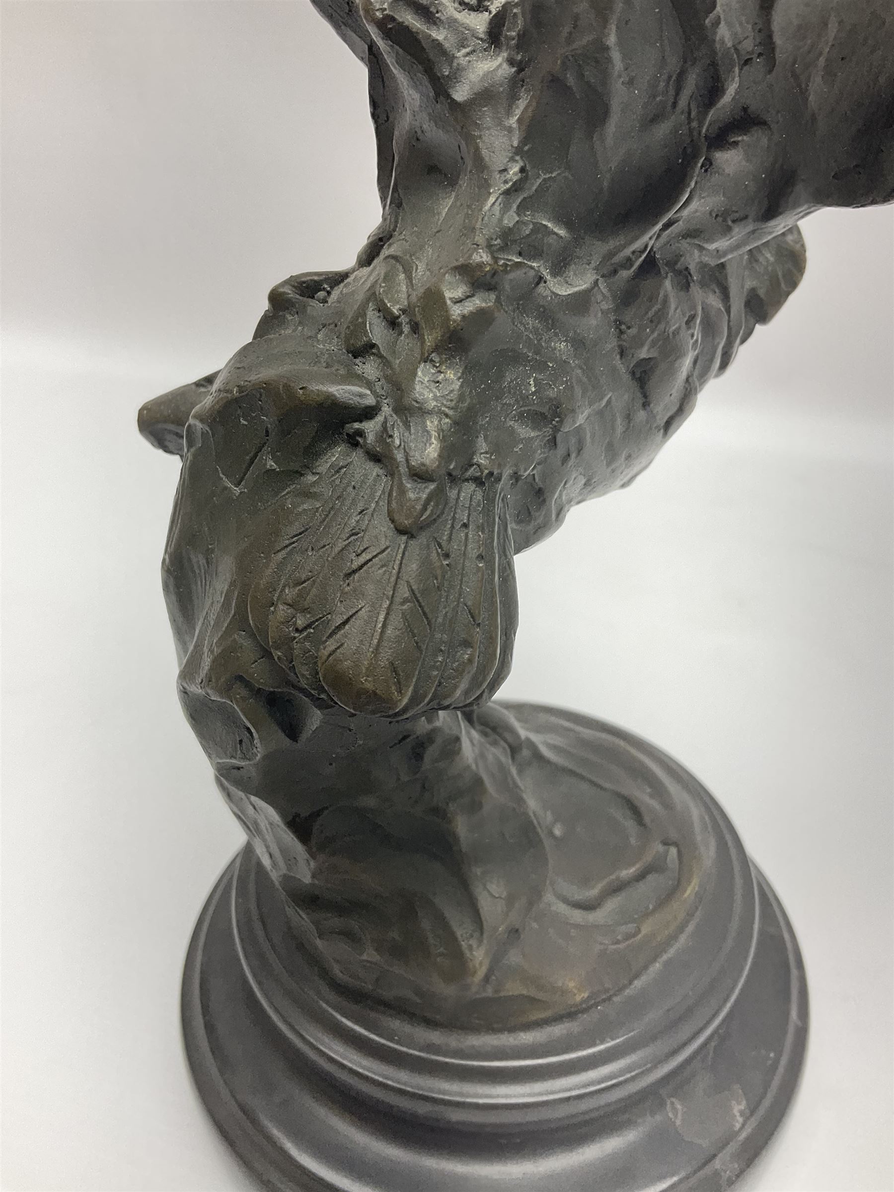 Bronze figure, modelled as an owl upon a rock, on stepped circular base, after Milo, H24.5cm