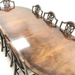 G T Rackstaw - Georgian style cross banded mahogany twin pedestal dining table, turned columns on brass capped shaped supports (W184cm and W246cm, H78cm, D104cm) and set eight (6+2) Hepplewhite style chairs, upholstered seat, square tapering supports on spade feet (W57cm)