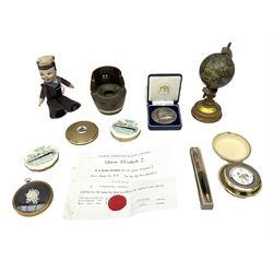 Silver 1969 Cunard RMS Queen Elizabeth maiden voyage commemorative medallion, in original Slade, Hampton & Son case with certificate, two Stratton R.M.S Queen Elizabeth mirror compacts, Stratton R.M.S Queen Mary compact, mid 20th century P&O Canberra Round World Voyage miniature globe, S.S Oriana ash tray modelled as a barrel, Norah Wellings sailor doll, and other maritime and shipping memorabilia 