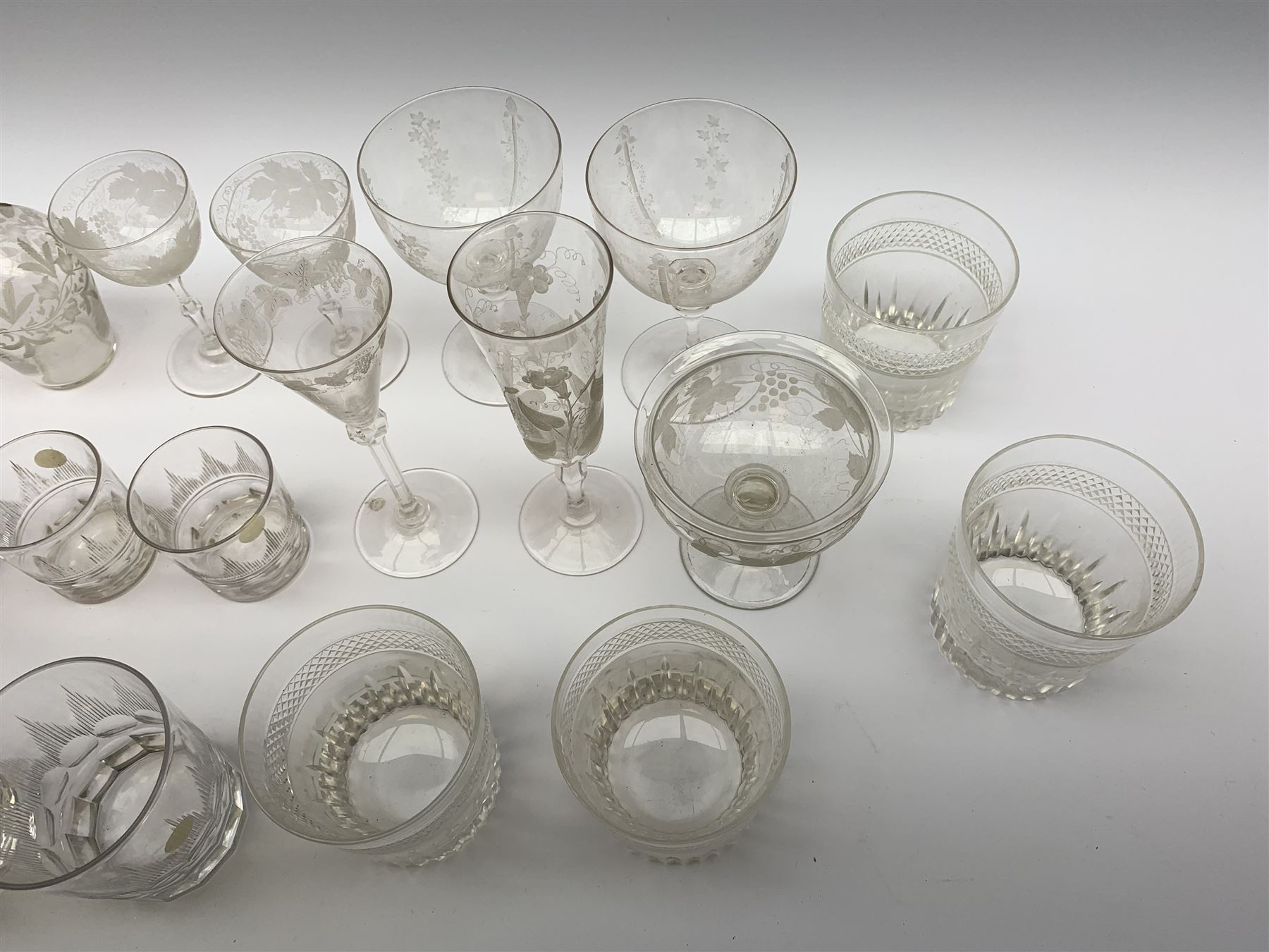 A number of Victorian tumblers and Edwardian drinking glasses, together with a large quantity of other later glassware, to include a glass table lamp base, drinking glasses of various forms, a number with cut decoration, other assorted cut glass including jug, vases, jars and covers, etc. 