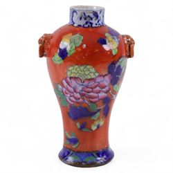 Chinese vase, of baluster form,  with floral decoration on an orange ground, with partial ...