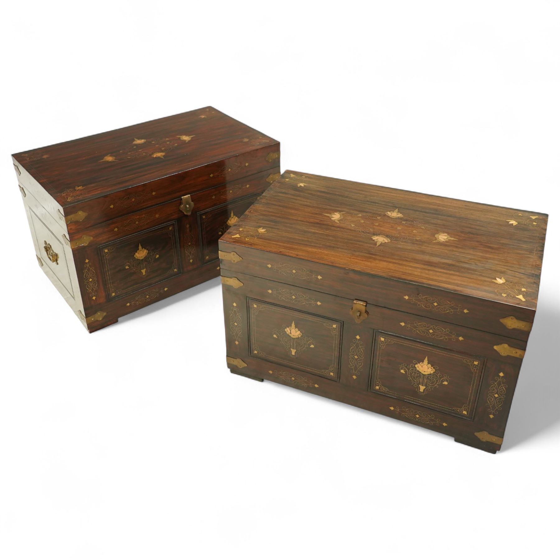 Pair of late 19th century colonial hardwood and brass inlaid chests, each rectangular with hinged top and brass strapping, floral and urn pattern inlay to the panels, with pierced brass side handles, fitted baize-lined butlers tray
