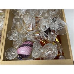 Four boxes of glassware to include drinking glasses, art glass vase signed beneath, coloured glass etc