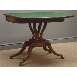  Regency mahogany card table, fold over swivel top with rosewood banding and scrolled inlay, baize lined, four serpentine pillar supports on platform, four splayed supports with brass claw cups and globular running castors, ebonised geometric inlays, W91cm, H74cm, D45cm  