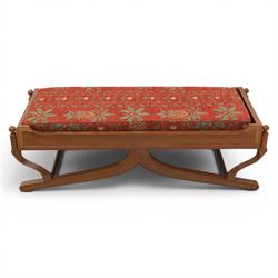 Traditional design teak long foot stool, red patterned seat cushion, on an X-frame base