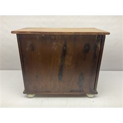 Miniature pine chest, fitted with two short and three long drawers with ceramic handles, H38cm