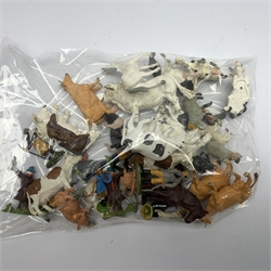 Farmyard layout including large walled wooden base board 61 x 45cm with various wooden buildings and plastic accessories, die-cast tractors and farm machinery by Britains, Ertl etc, plastic farm animals and figures by Britains etc