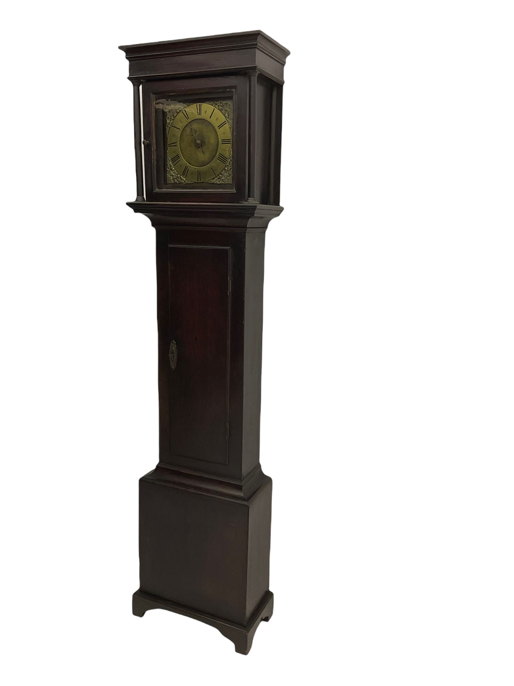 A mid-18th century 30-hour provincial longcase clock by John Darke of Holdsworthy (Devon), in an oak case with a flat-topped pediment, square hood door flanked by two free standing pillars with brass capitals, trunk with a flat-topped full-length door on a rectangular plinth with applied shaped skirting, a 9-1/2” square brass dial with a matted centre and brass (unsilvered) chapter ring, engraved with roman numerals, half and quarter hour divisions, single steel hand and 