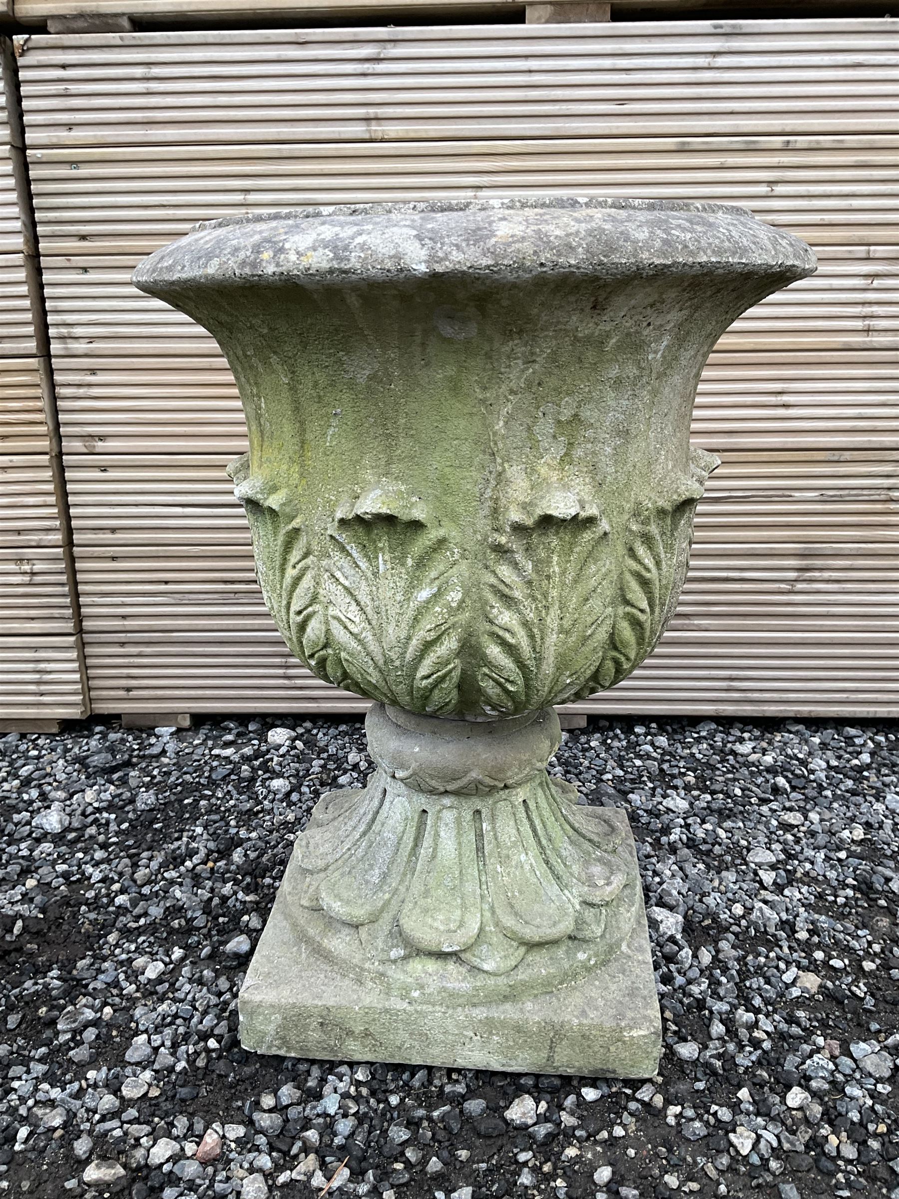 Cast stone urn, moulded rim leaf decorated body, moulded footed base on square plinth - THIS LOT IS TO BE COLLECTED BY APPOINTMENT FROM DUGGLEBY STORAGE, GREAT HILL, EASTFIELD, SCARBOROUGH, YO11 3TX