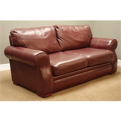  Two seat sofa (W187cm), and matching armchair (W105cm), upholstered in burgundy leather  