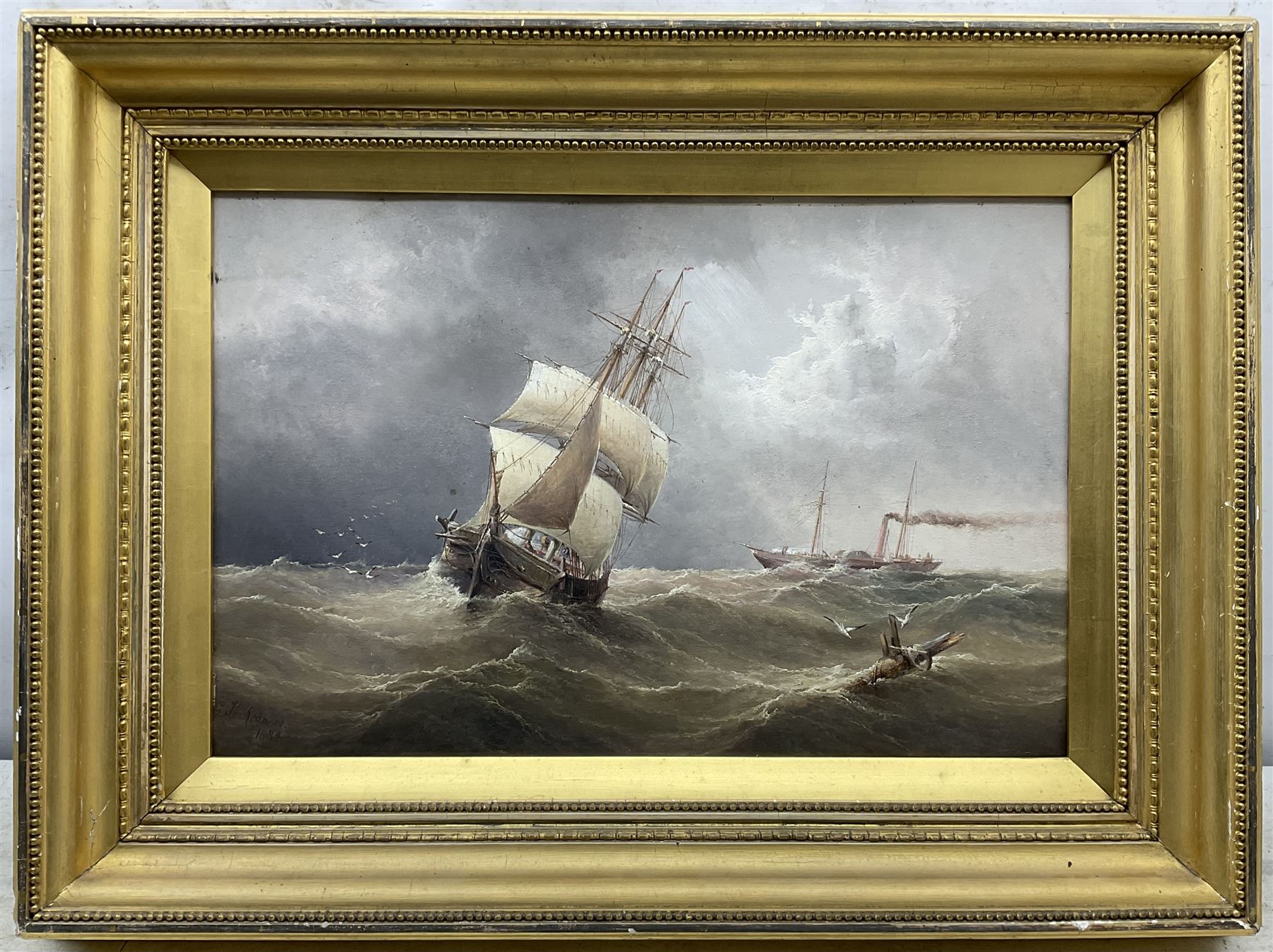 Henry Redmore (British 1820-1887): Sailing Ship and Steamer on Rough Seas, oil on board signed and dated 1884, 34cm x 52cm