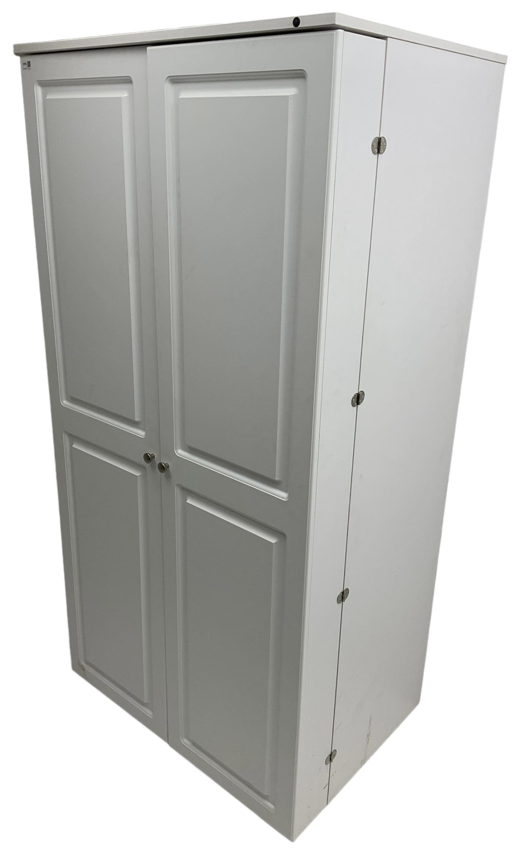 Large white finish sewing cabinet, enclosed by two doors fitted with thread holders and shelves, the interior fitted with shelves and sliding trays, with fold down work surfaces 