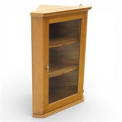 Unicornman - glazed oak corner cabinet, the triangular top with moulded cornice above a be...