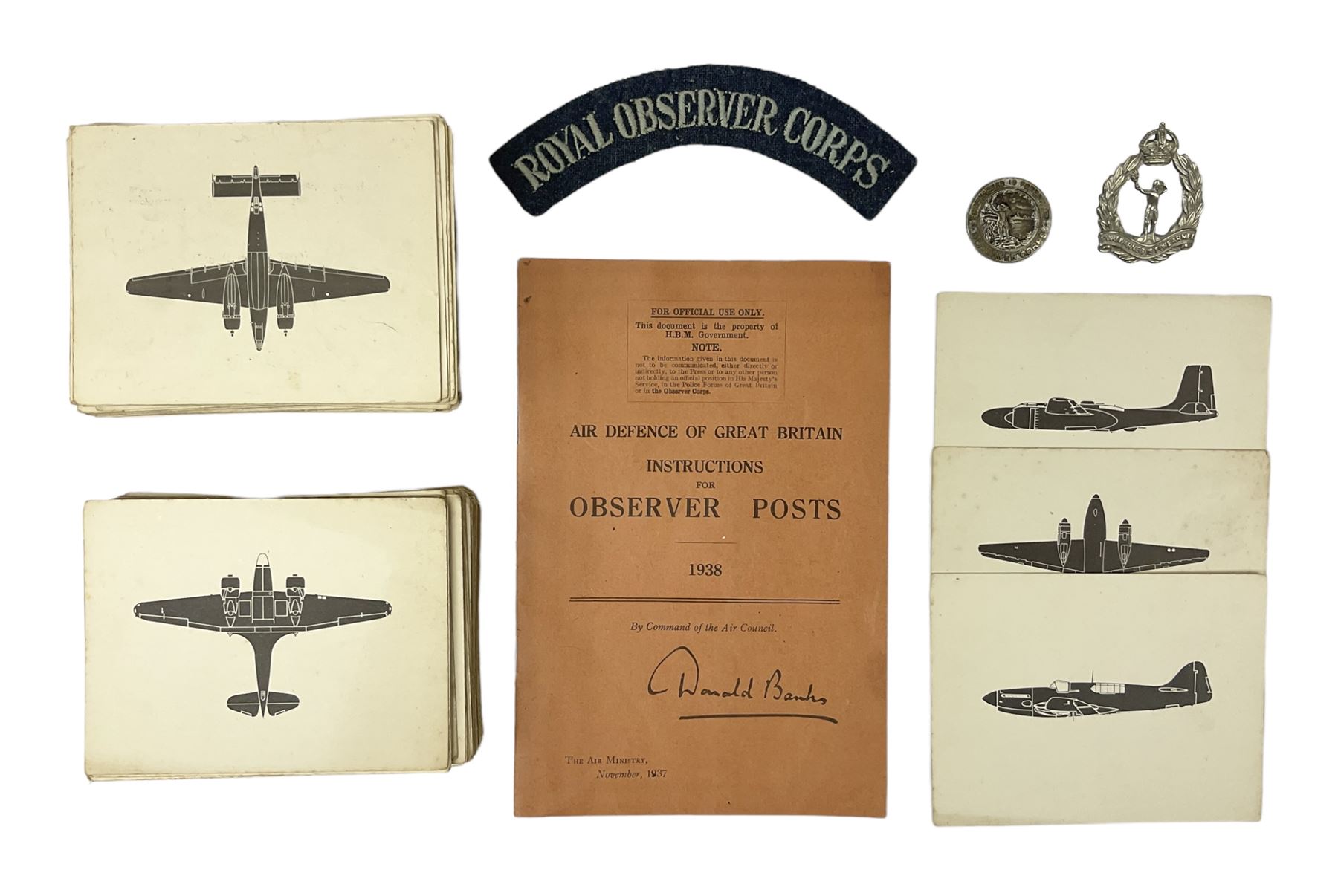 WW2 Royal Observer Corps - approximately one-hundred and seventy aircraft recognition cards; 1938 Instruction Booklet; cap badge and lapel badge; and cloth shoulder title
