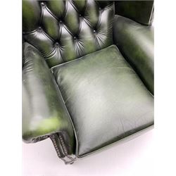 Georgian style wing back armchair upholstered in green buttoned leather 