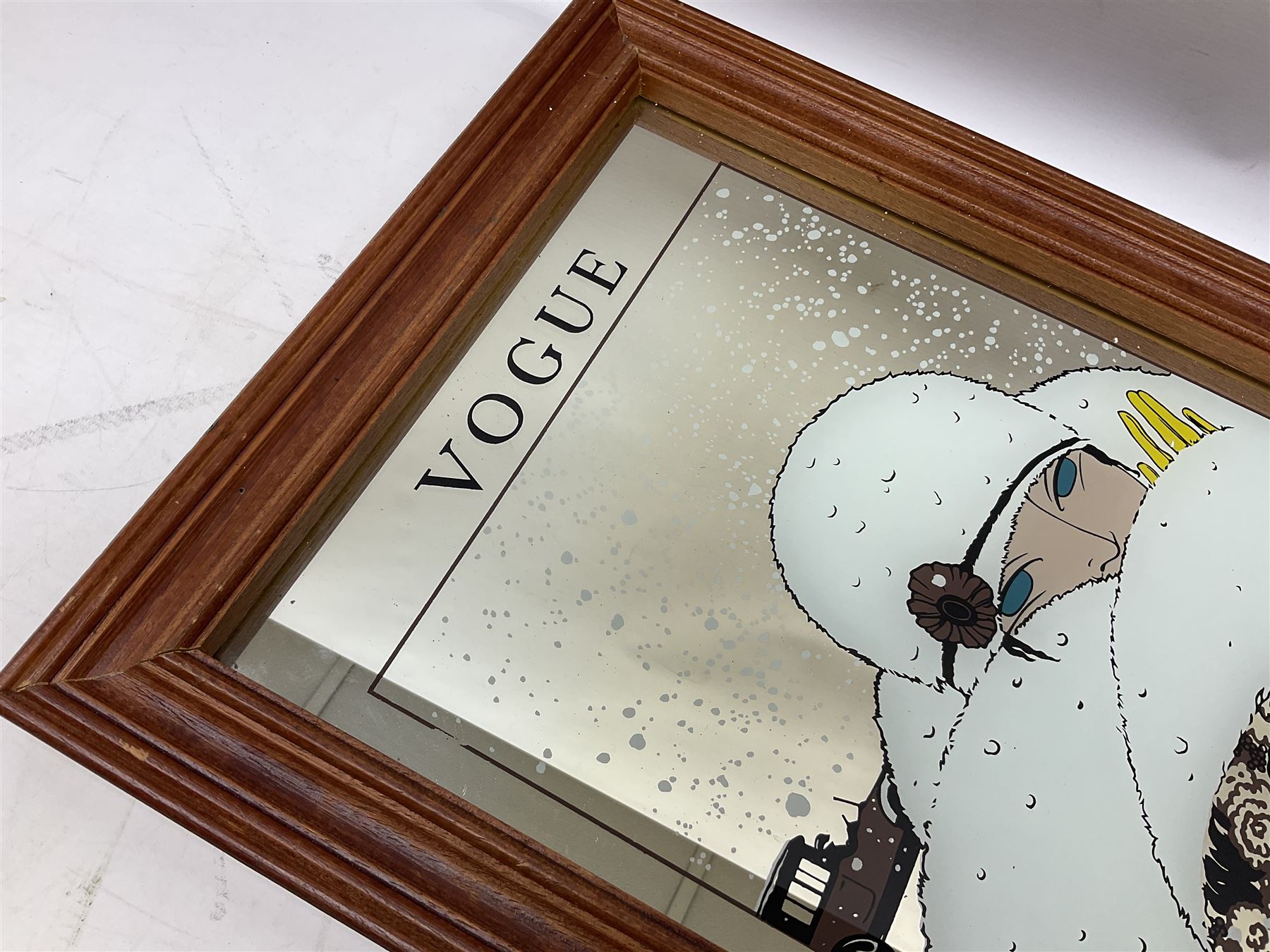 Wall mirror printed with a February 1919 Vogue cover of an Art