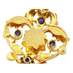 Victorian 15ct gold sapphire and split pearl pendant / brooch, the central flower head cluster set with a round cut sapphire surrounded by pearls, amongst an openwork setting set with four further sapphires and pearls, the reverse with presentation engraving and detachable brooch setting