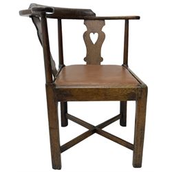 Georgian oak corner elbow chair, heart pierced back splats over tan leather drop-in seat, raised on square supports with inner chamfer joined by X-stretcher