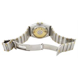 Omega Constellation gentleman's stainless steel and gold automatic chronometer wristwatch, Ref. Cal. 1111, serial No. 49547890, white dial with date aperture and exhibition back case, on integral bracelet No. 1448.5/431, with fold-over clasp