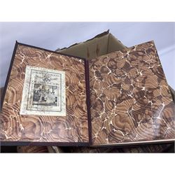 Thirty six volumes of Encyclopaedia Britannica with gold tooled red leather spines in various editions 