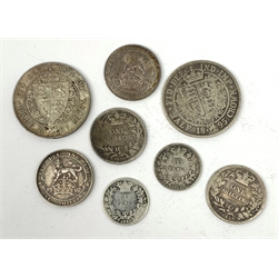 Two Queen Victoria half crowns dated 1895 and 1897, 1839 and 1865 one shilling coins, 1843 and 1871 sixpence pieces and two King Edward VII one shilling coins dated 1902 and 1918 (8)