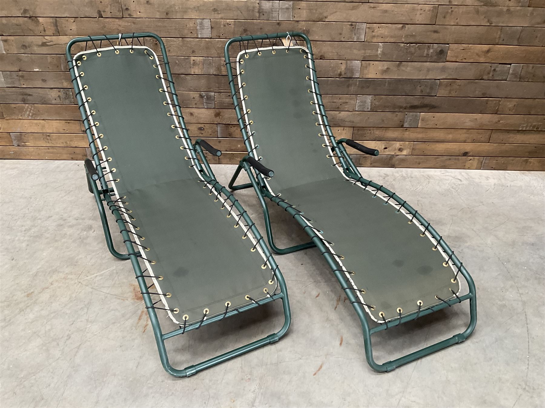 Pair metal framed folding sun loungers