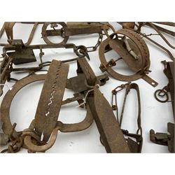 Quantity of animal traps including, gin traps, mole traps, Henri Marty wirework cage trap etc. Auctioneer's Note: These traps are sold as artefacts for ornamental purposes only as the use of some of them is illegal.